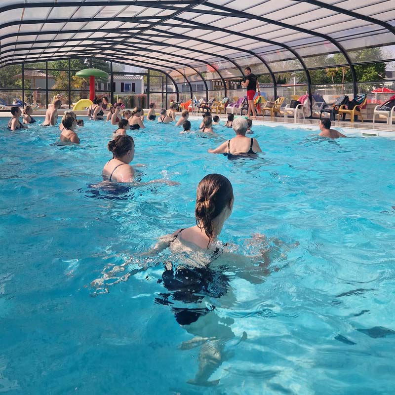 Campers in the indoor aquatic area of the campsite near La Baule