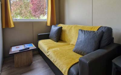 View of the living room of the Nantes 5-person chalet model in Saint-André-des-Eaux